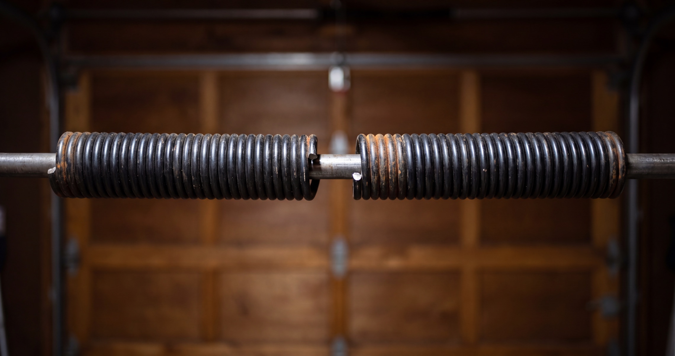 Failed garage door torsion spring close-up
